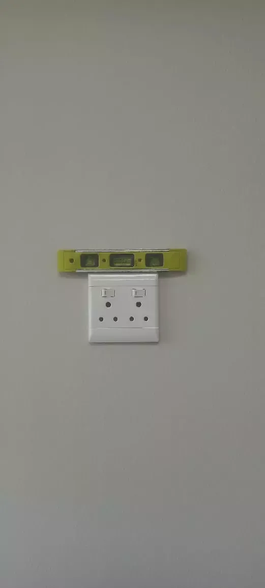 Electrical wall socket with a spirit level installed neatly